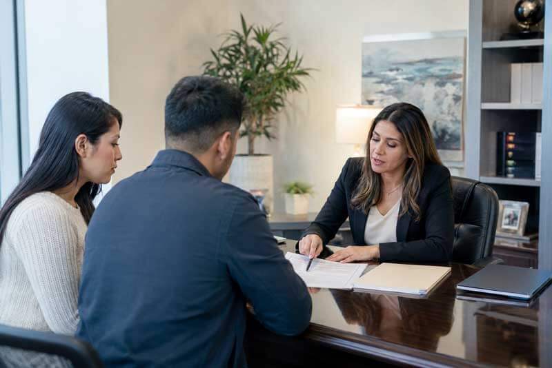 immigration attorney consulting with Venezuelans about TPS
