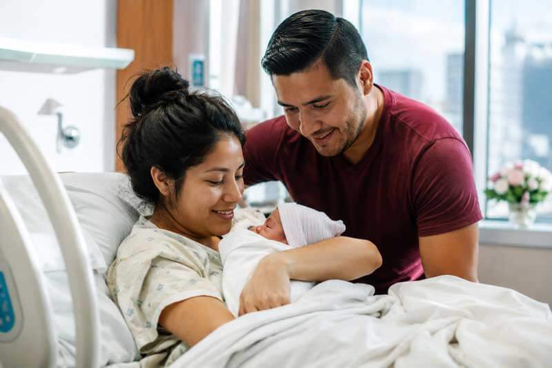 Immigrant family with a newborn baby at a hospital in the United States